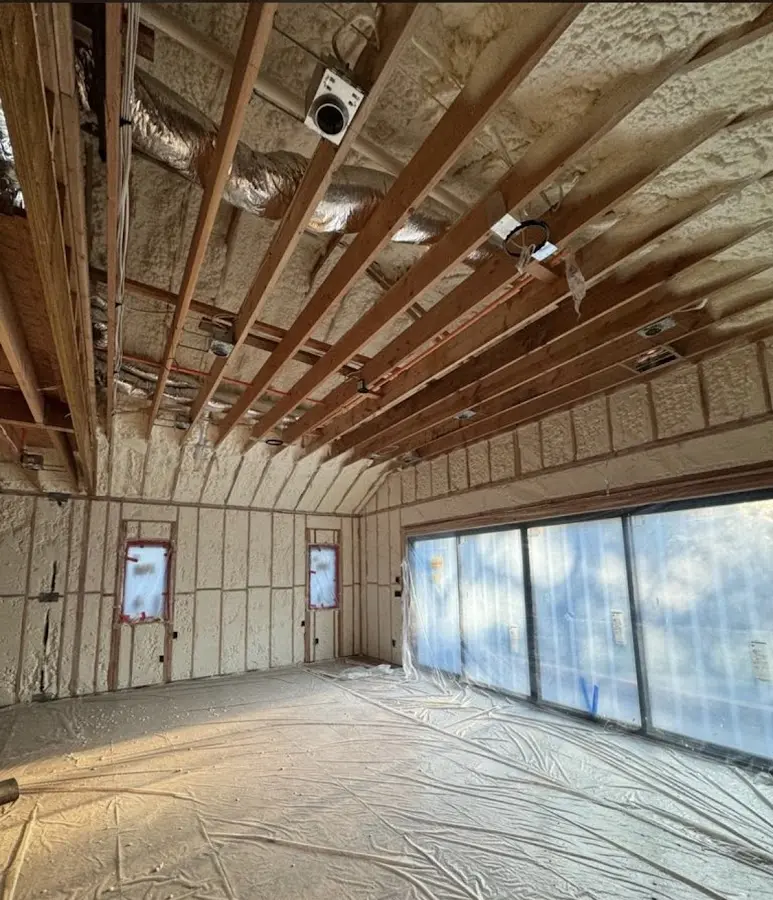 Interior walls and ceiling insulated with spray foam during new construction in Alta Sierra